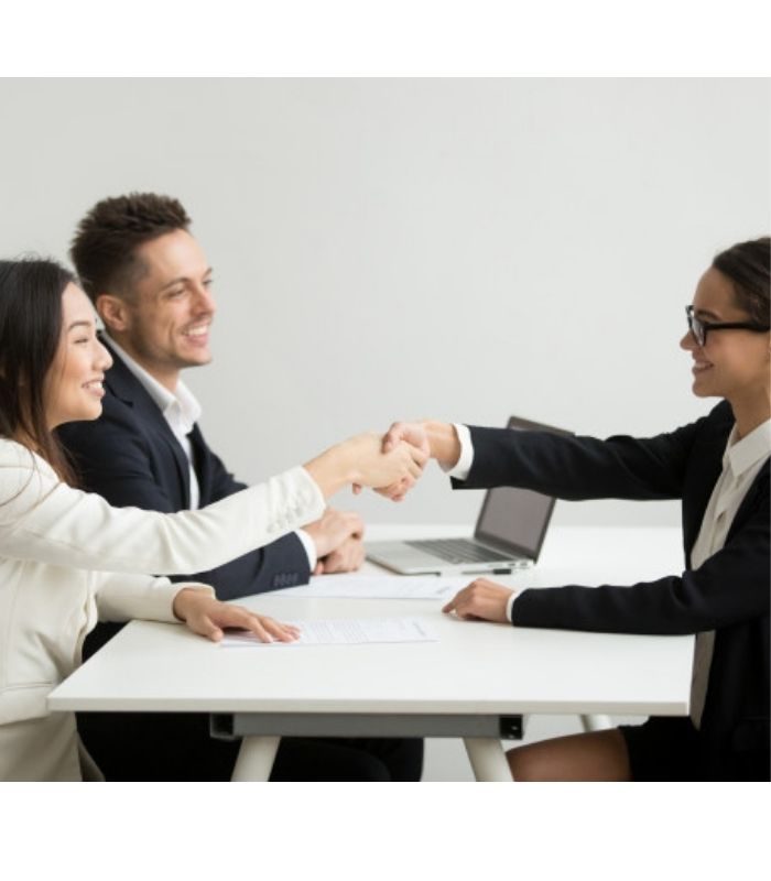 smiling-diverse-businesswomen-shake-hands-group-meeting-deal-concept_1163-4686